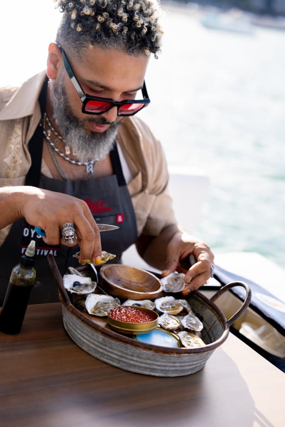 A culinary creator preparing an on-water tasting experience