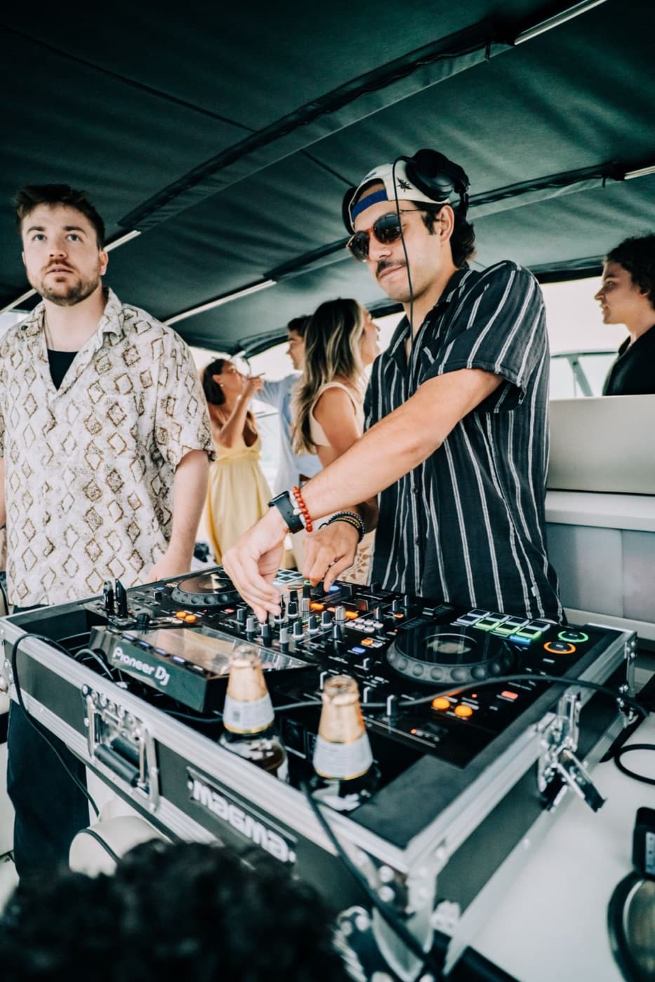 A DJ performing during a Playpen boat experience
