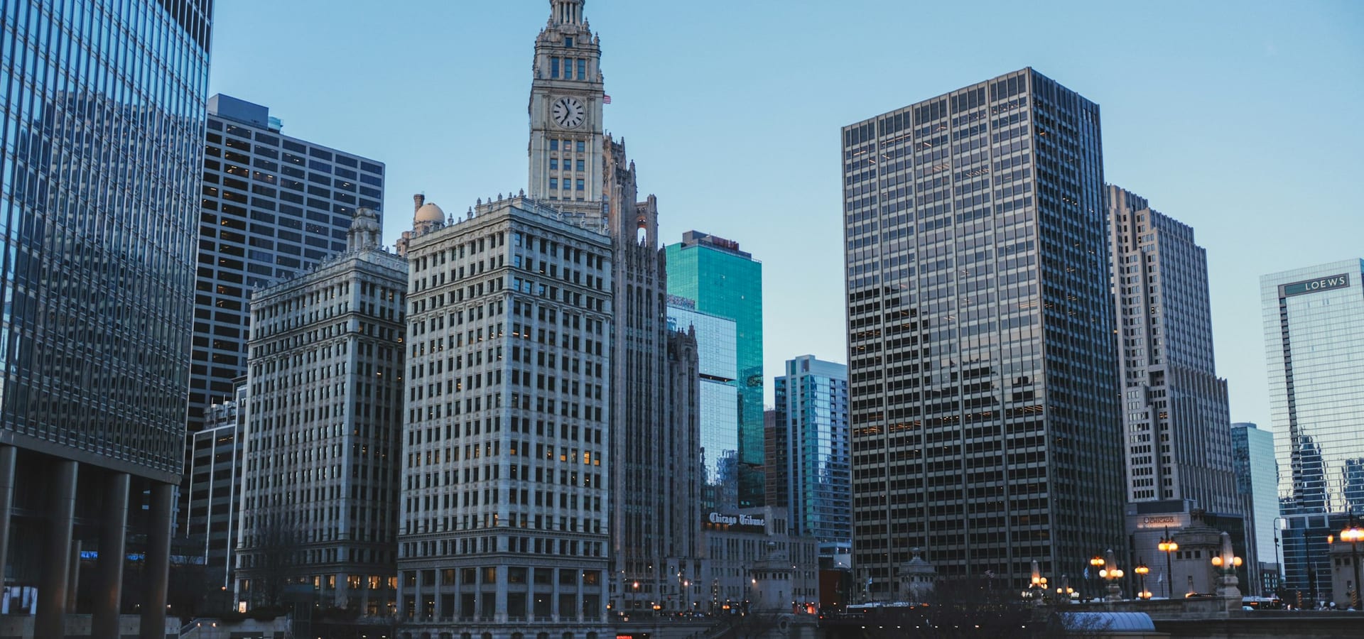 Chicago River at twilight with boats and skyline